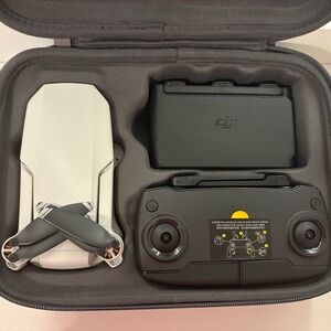 DJI Foldable Drone with Black Controller and Gray Case